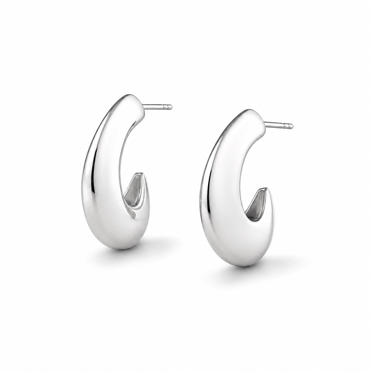 Pair of sterling silver crescent hoops earrings on a white background