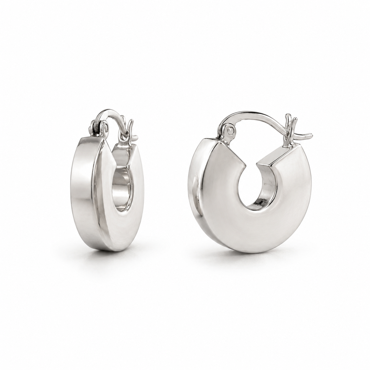 Pair of silver hoop earrings on a white background
