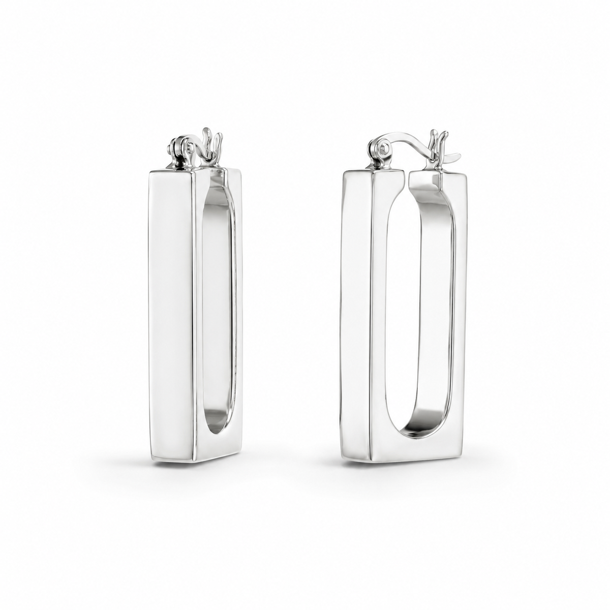 Pair of rectangle silver hoop earrings on a white background
