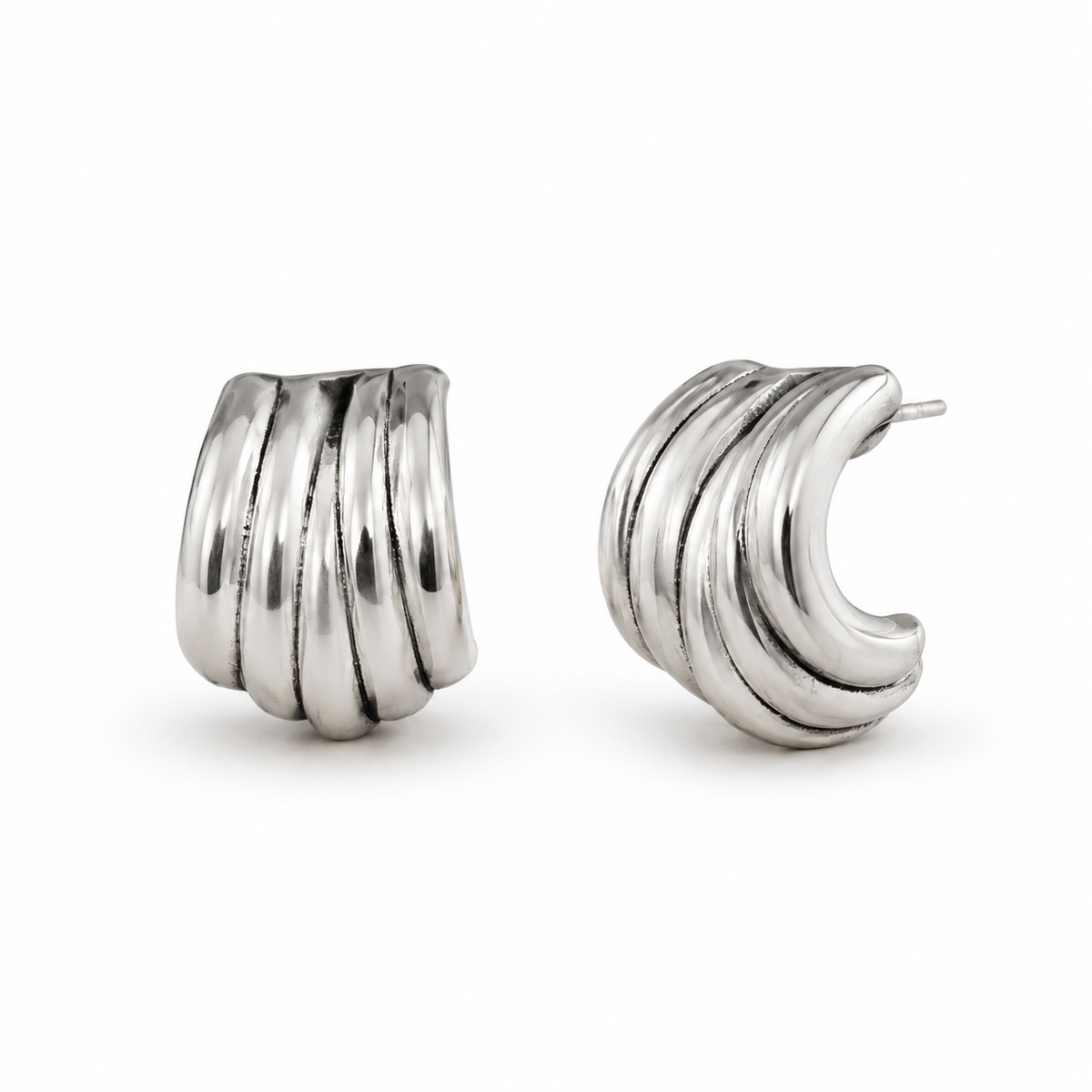Pair of silver hoop earrings on a white background