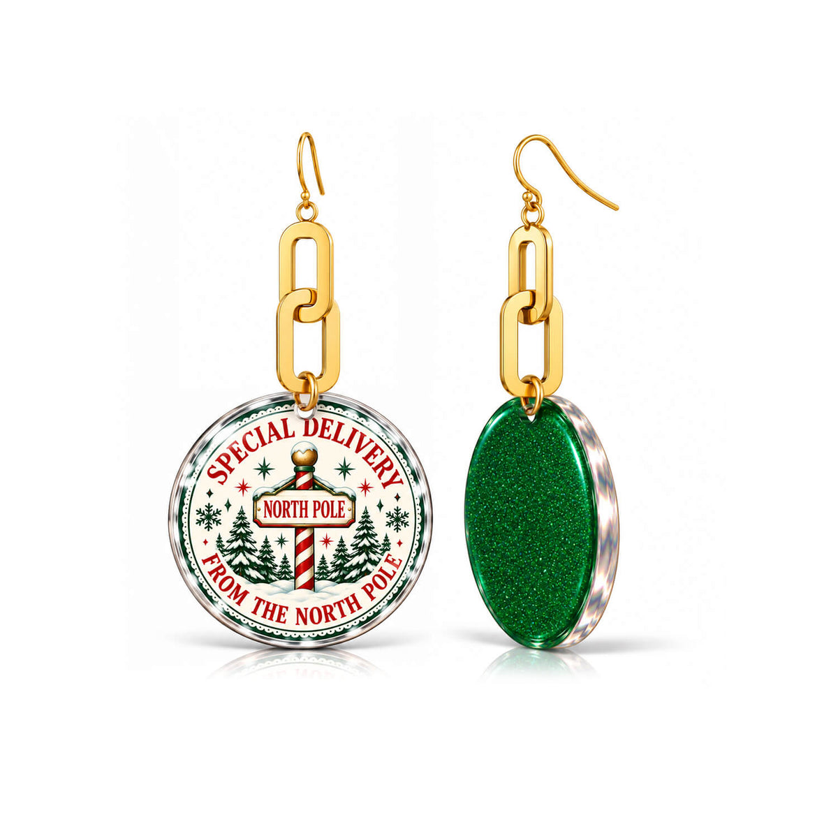 A pair of gold-tone dangle earrings on a white background. One earring has a round clear-domed charm showing a Christmas-themed 'Special Delivery from the North Pole' graphic.