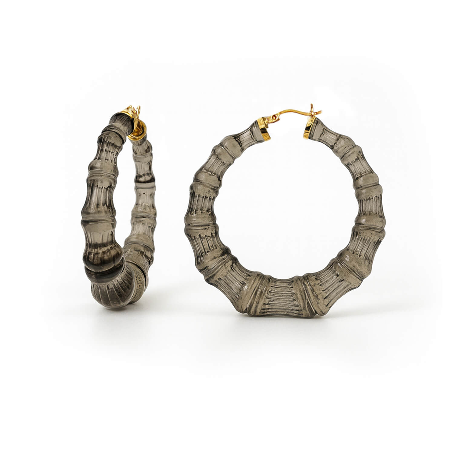 Pair of textured black bamboo hoop earrings on a white background