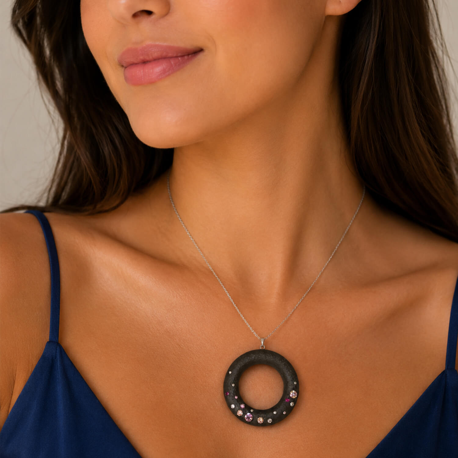 Woman wearing a necklace with a large circular pendant