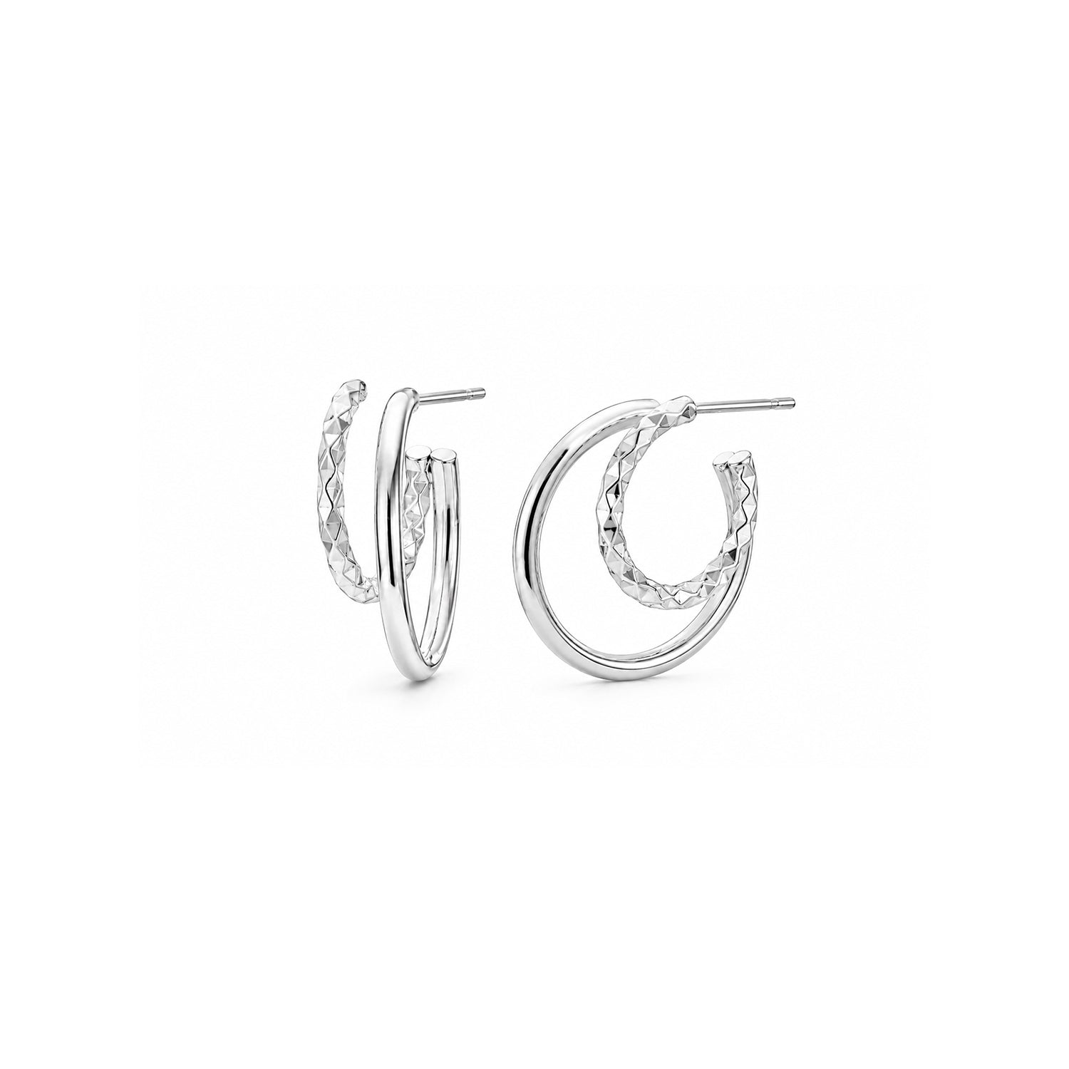 Silver earrings on a white background