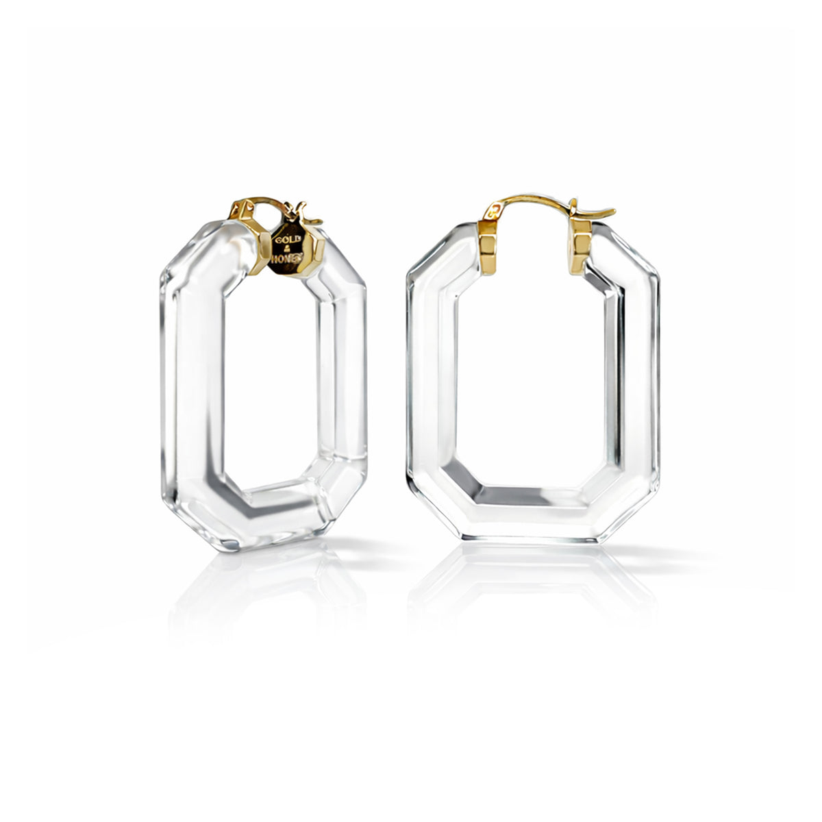 Clear hoop earrings with gold accents on a white background