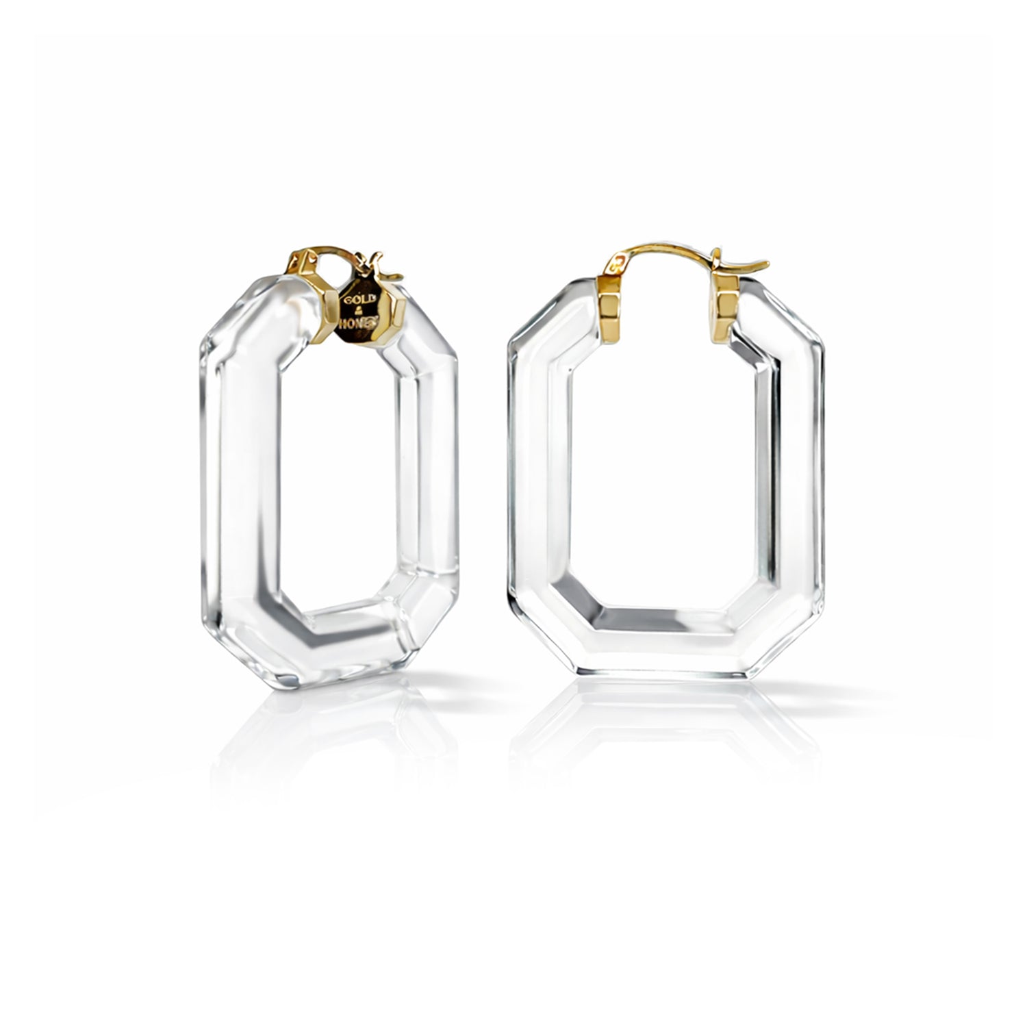 Clear hoop earrings with gold accents on a white background