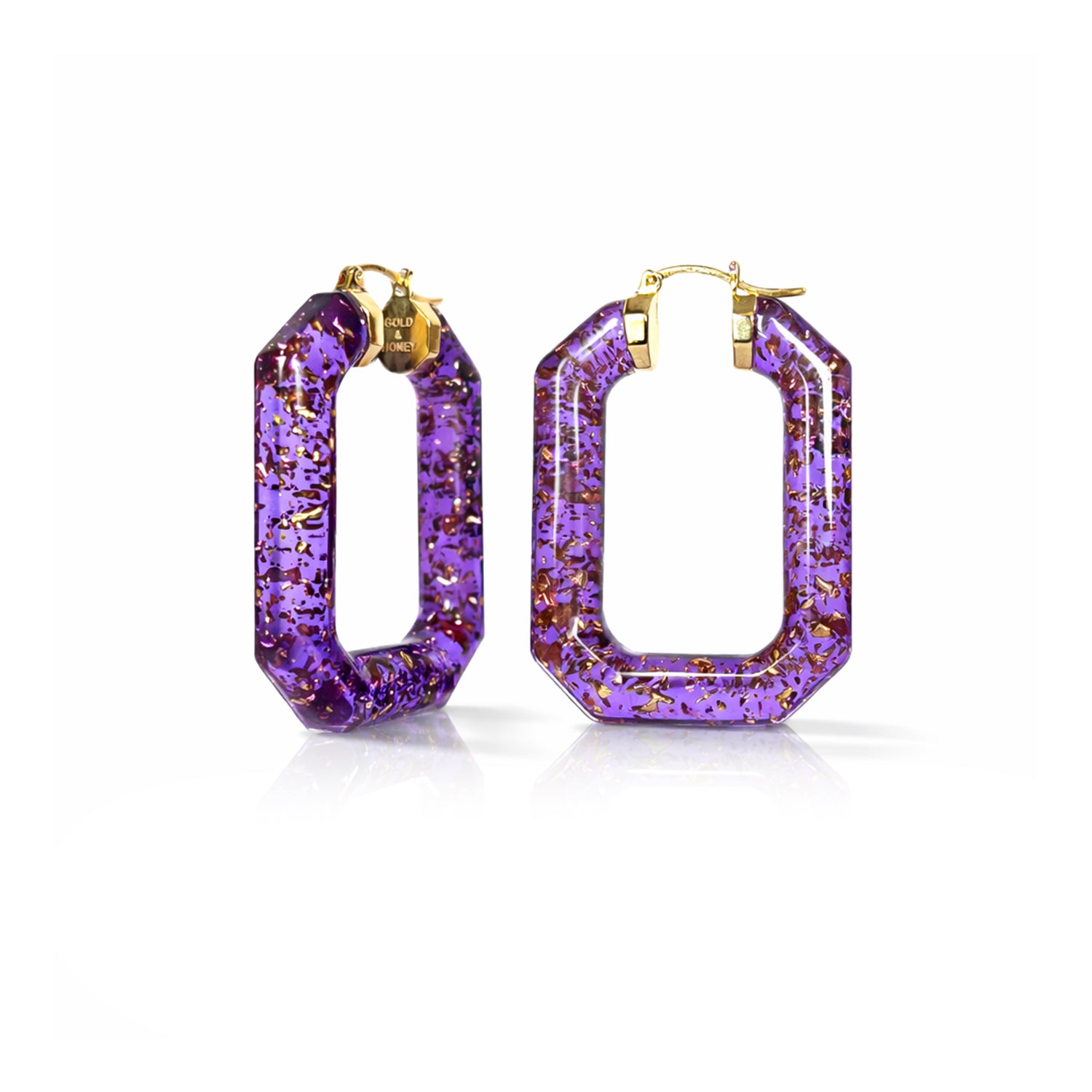 Purple hoop earrings with gold accents on a white background
