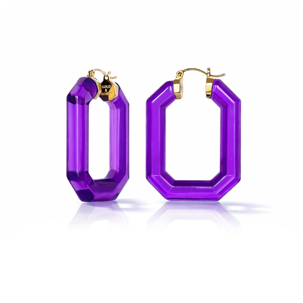 Purple hoop earrings with gold accents on a white background