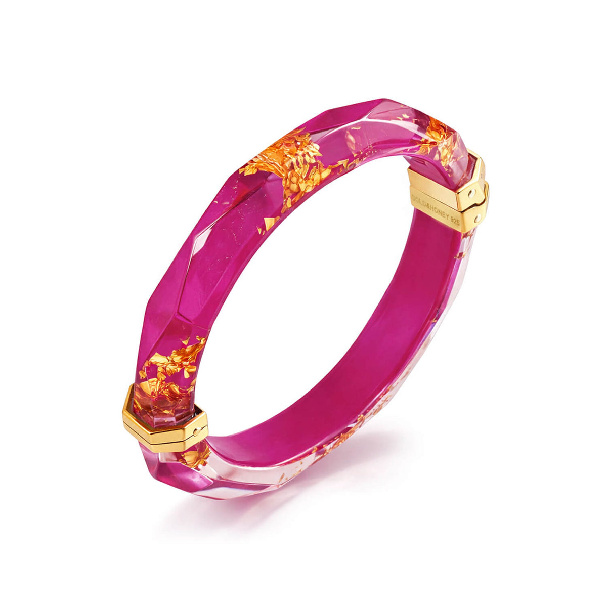 Pink bracelet with gold accents on a white background