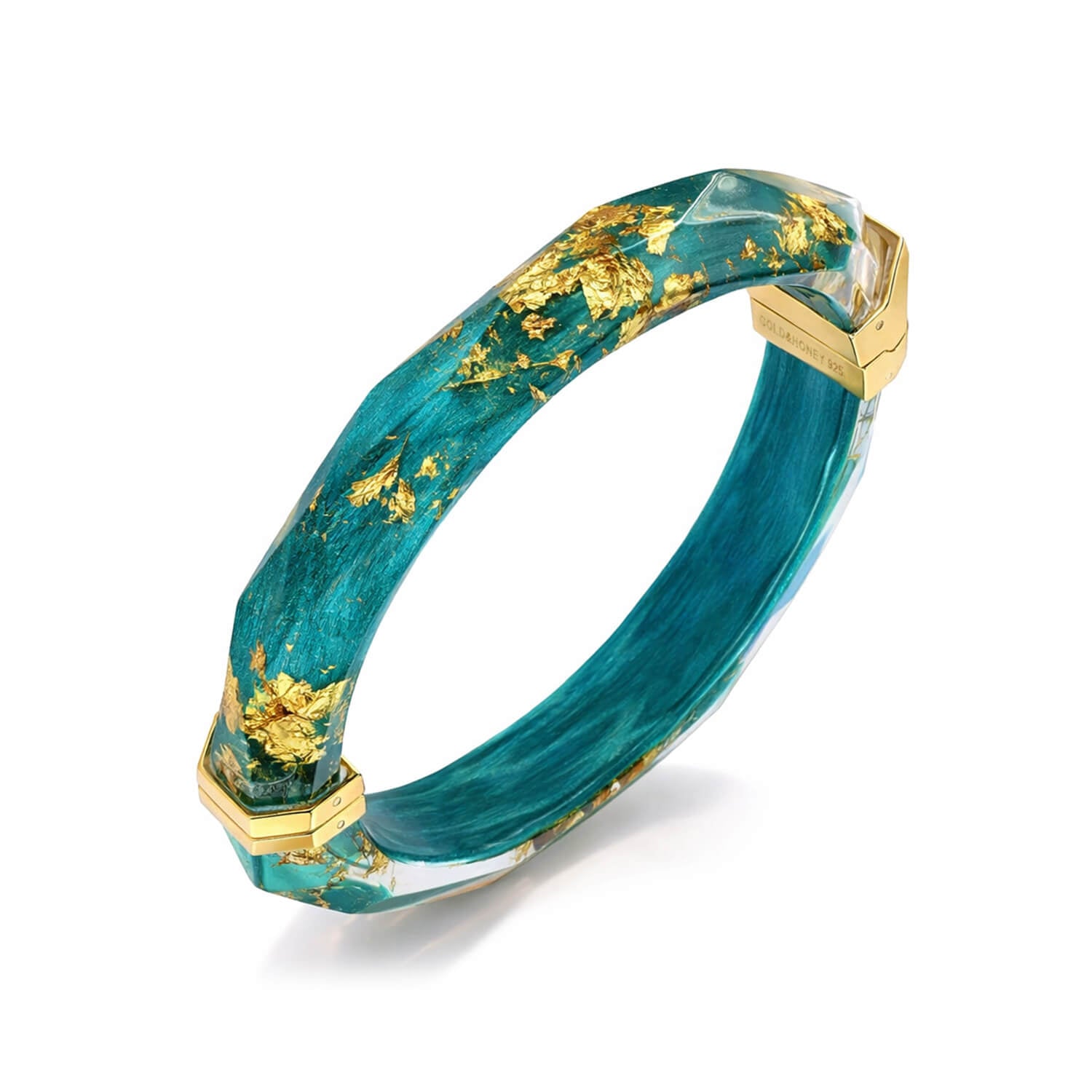 Teal bracelet with gold accents on a white background