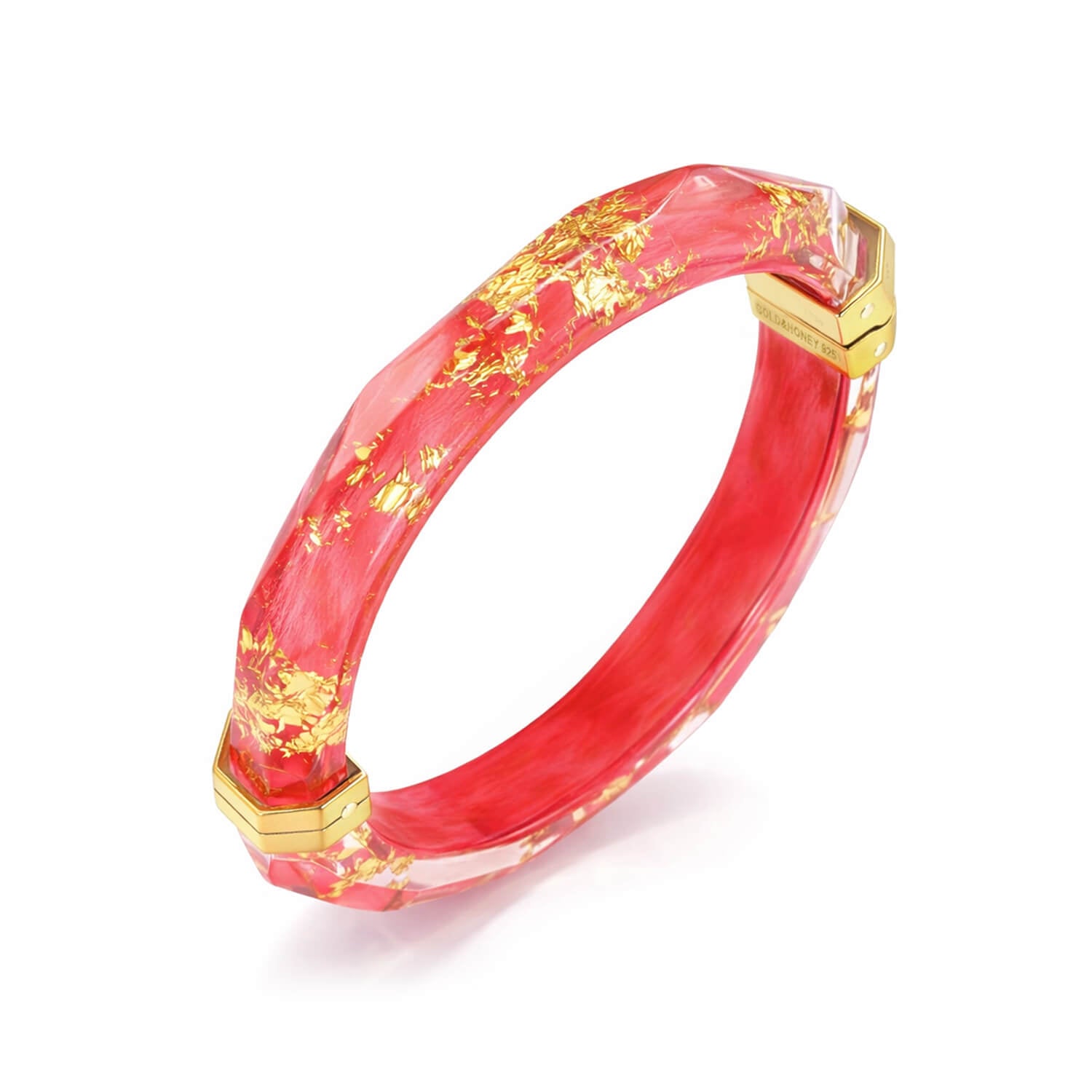 Red bracelet with gold accents on a white background