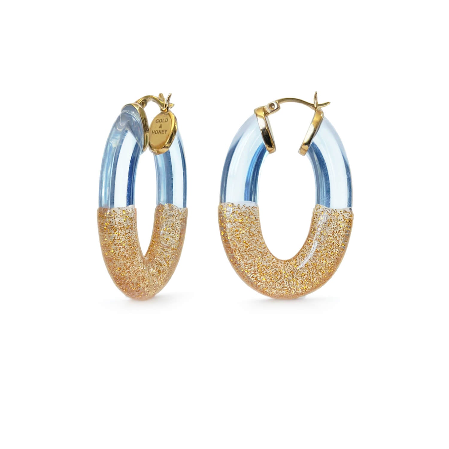 cinderella flat oval hoop earrings in blue and gold glitter