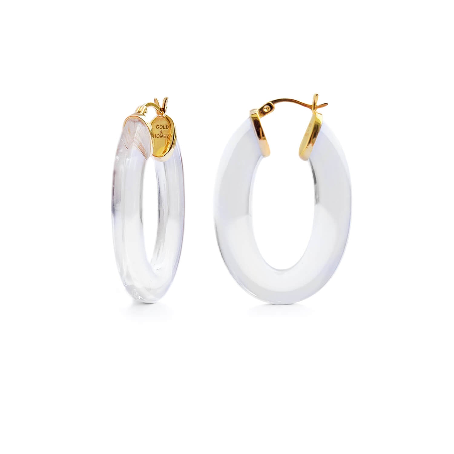 flat oval hoops in gold and clear lucite