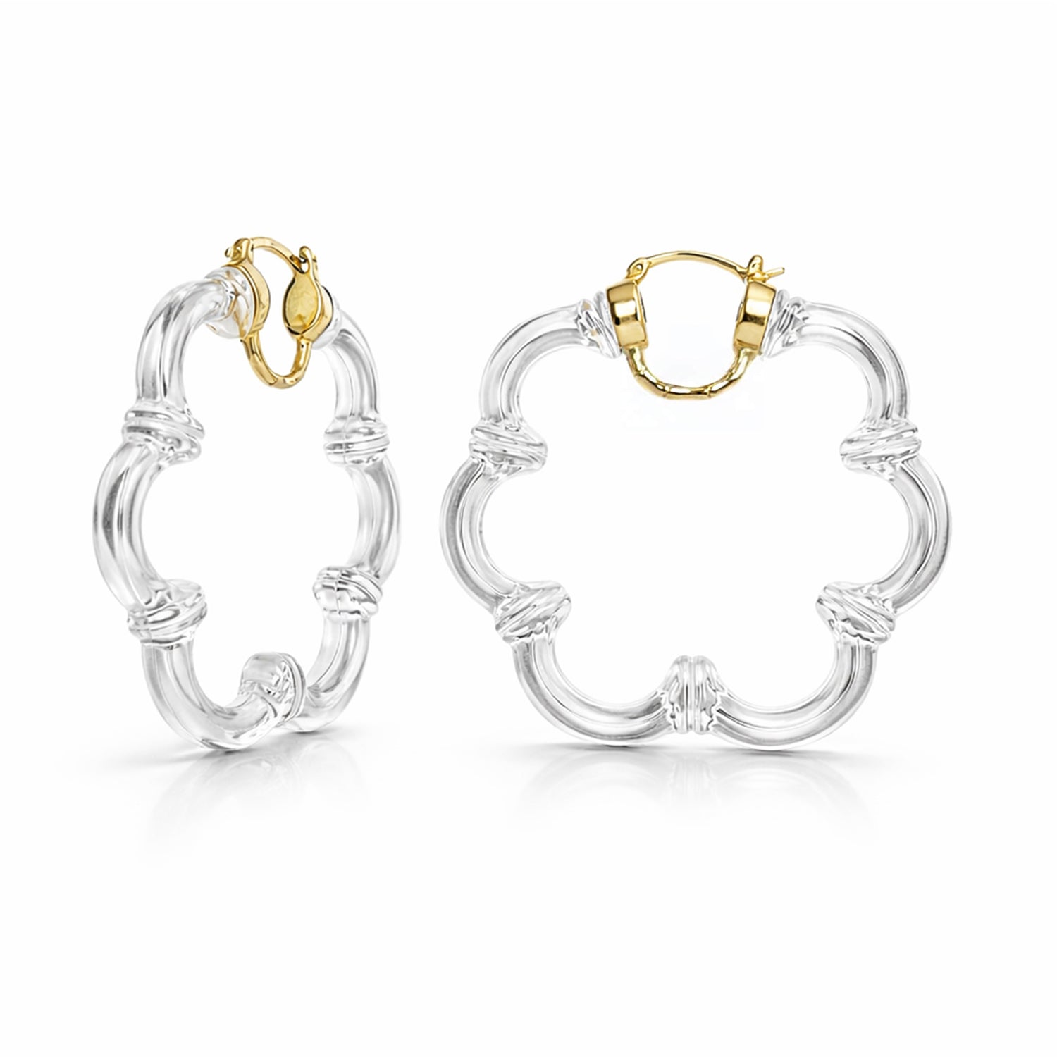Pair of flower shape hoop earrings with gold finishes on a white background