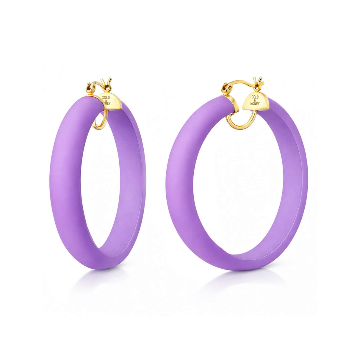 Purple hoop earrings with gold accents on a white background