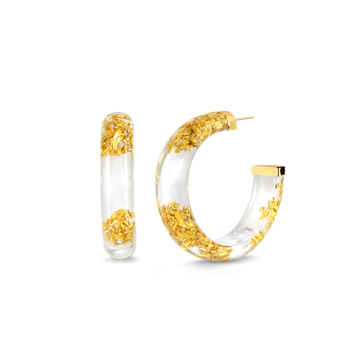 Gold and clear hoop earrings on a white background