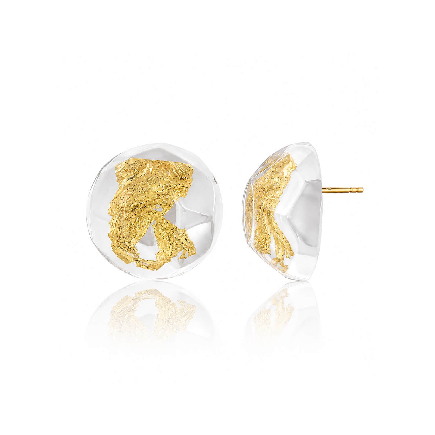 A pair of round clear resin stud earrings with textured gold leaf inlay, shown from both front and side angles on a white background with a soft reflection.