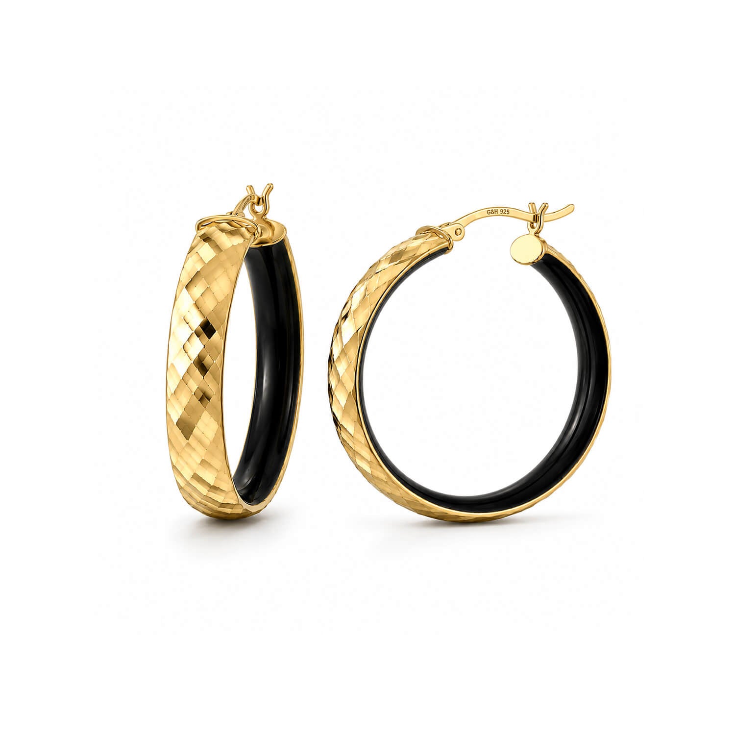 A pair of gold hoop earrings with a textured, diamond-cut exterior and a smooth black interior, shown on a clean white background.
