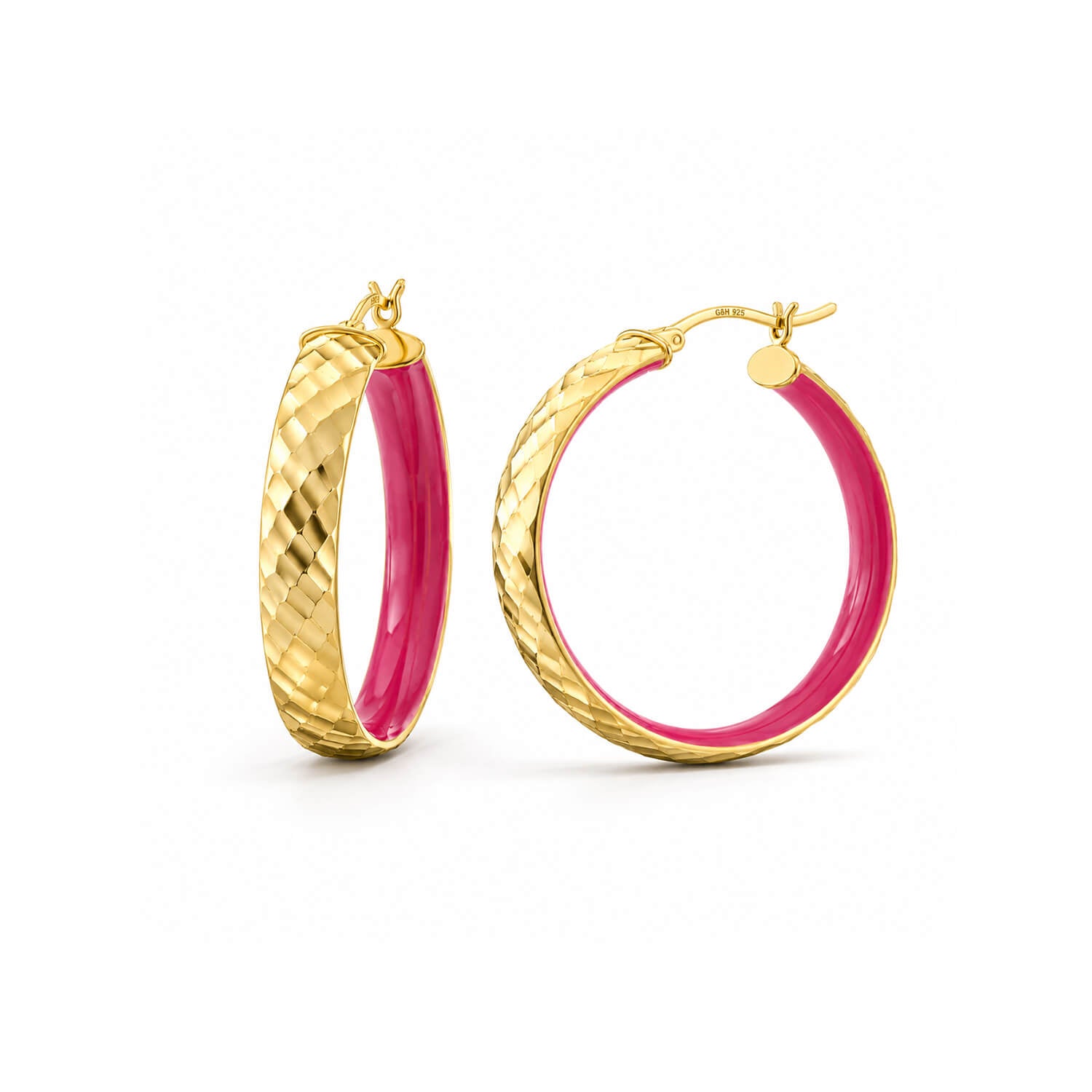 A pair of gold hoop earrings with a textured diamond-patterned outer band and a vibrant pink inner lining, shown on a clean white background.
