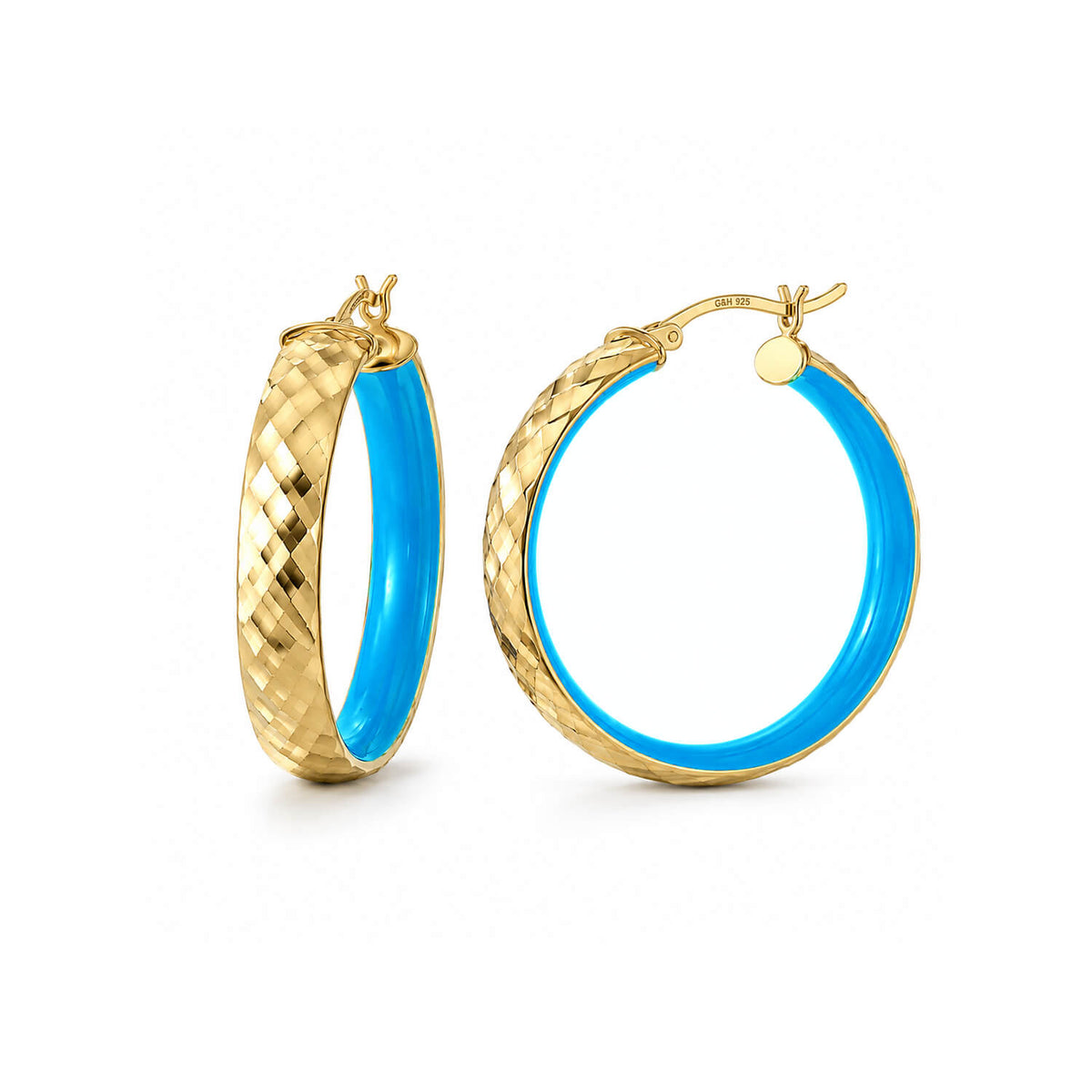 A pair of gold hoop earrings with a textured diamond-patterned outer band and a smooth, vibrant blue inner lining, shown on a clean white background.