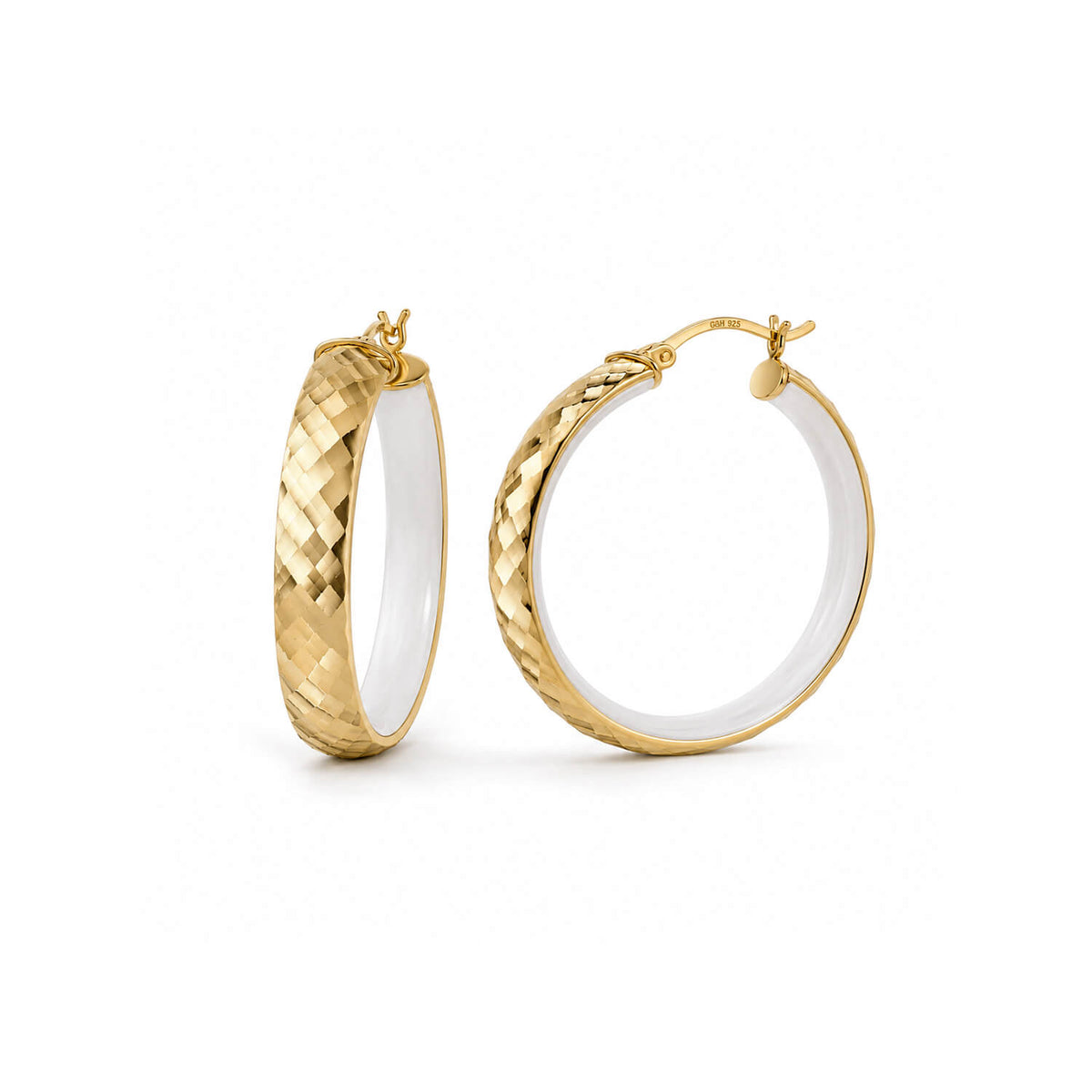 A pair of gold hoop earrings with a textured basketweave pattern on the outer surface and a smooth white interior, shown on a clean white background.