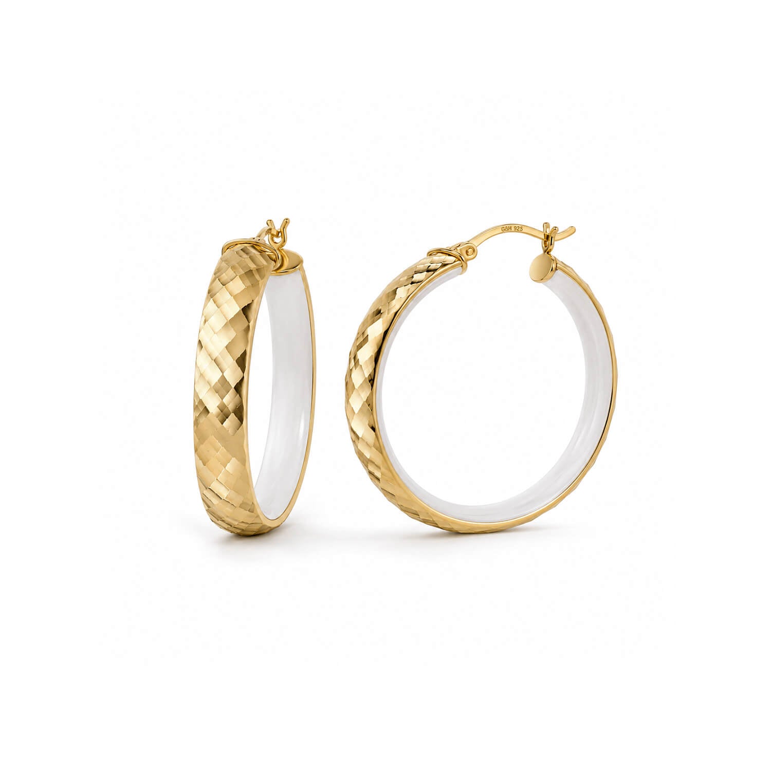 A pair of gold hoop earrings with a textured basketweave pattern on the outer surface and a smooth white interior, shown on a clean white background.