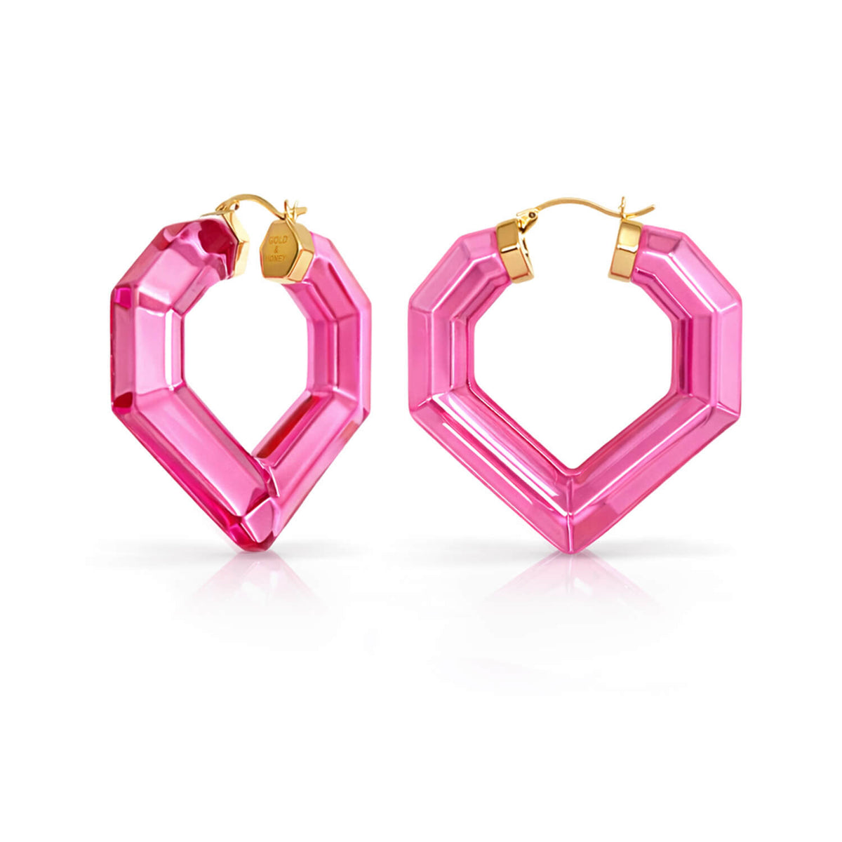 Pink hexagonal hoop earrings with gold accents on a white background