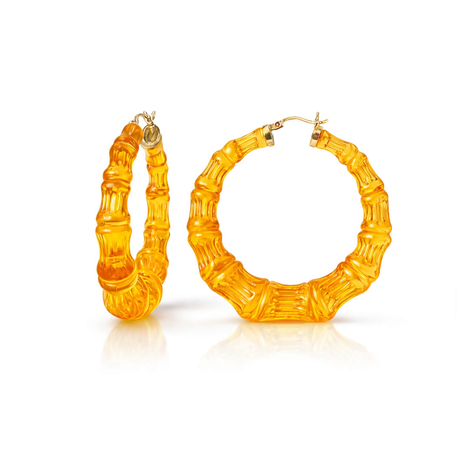 Pair of orange hoop earrings on a white background