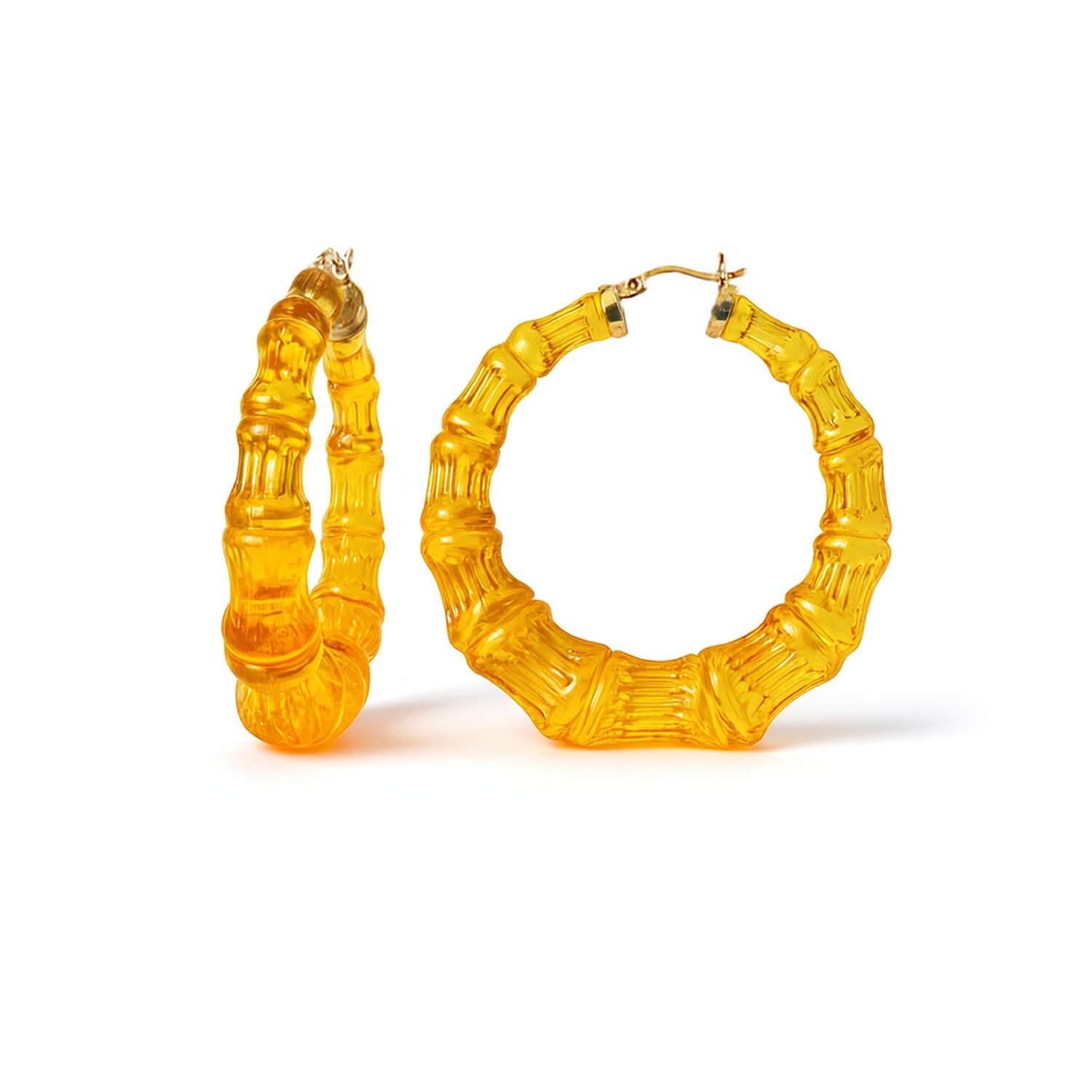 Pair of yellow honey gold bamboo hoop earrings on a white background