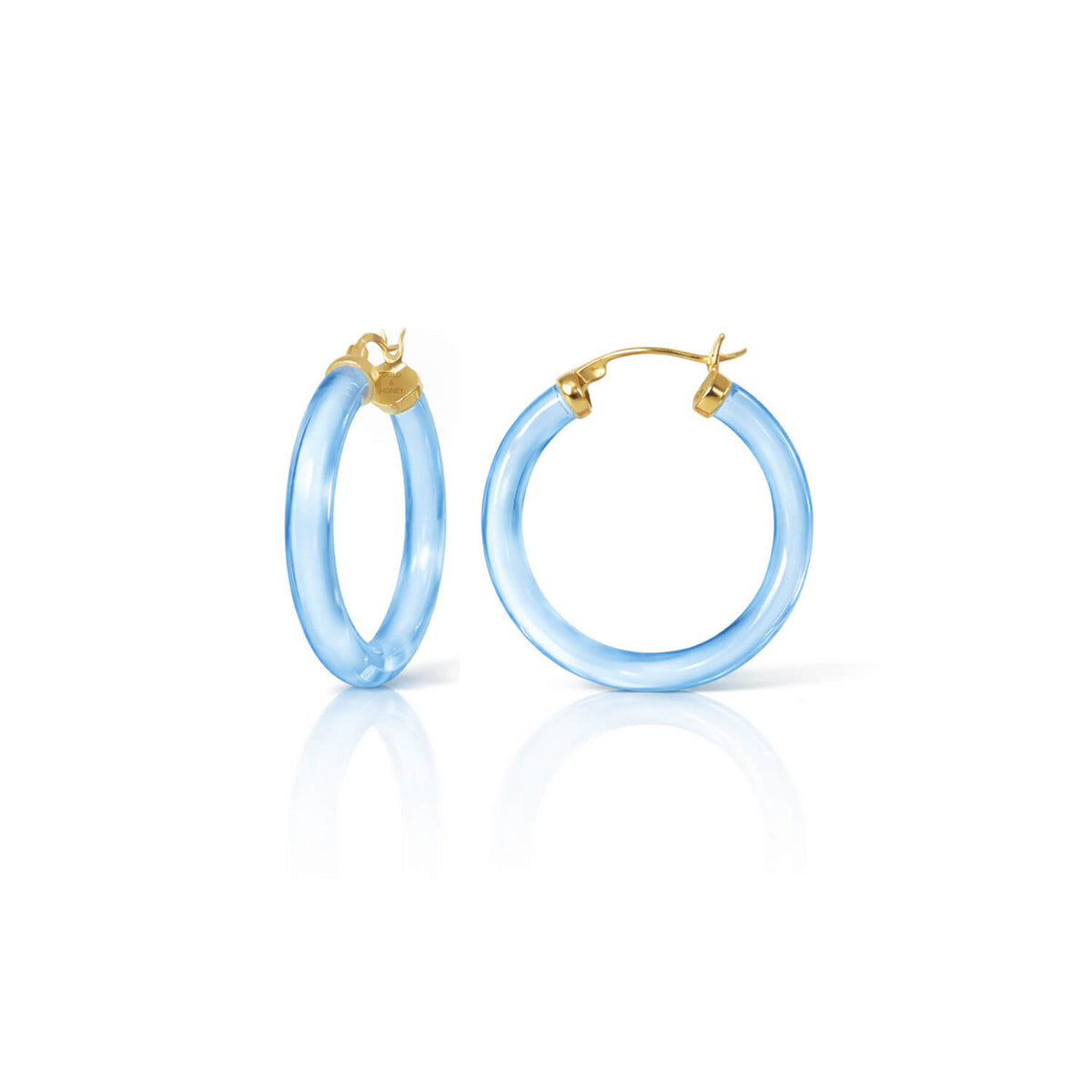 Pair of light blue hoop earrings with gold accents on a white background