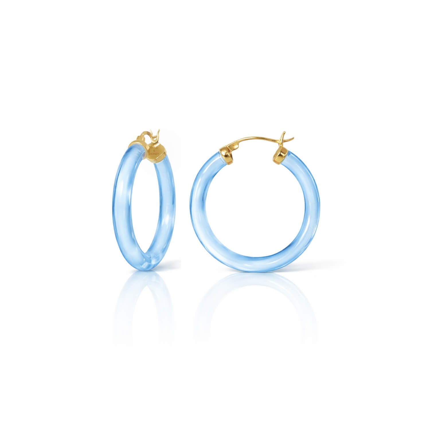Pair of light blue hoop earrings with gold accents on a white background