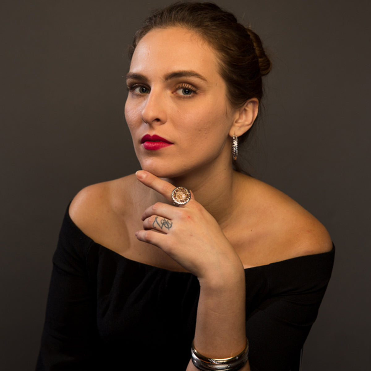 model wearing leopard ring on her index finger