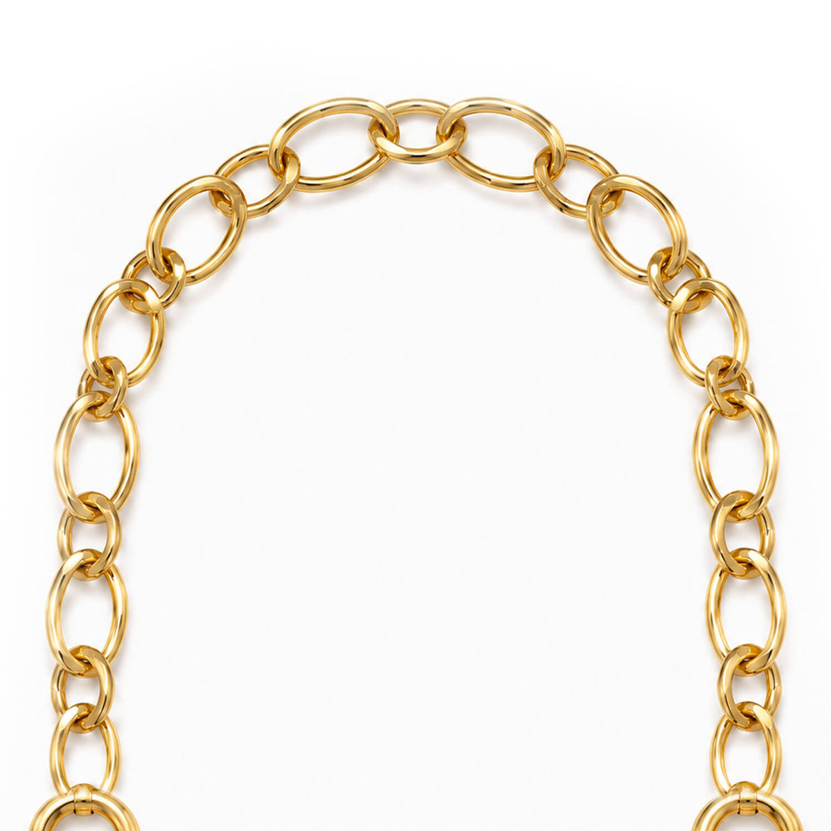 A close-up of a gold chain with large, polished oval links arranged in a curved shape against a plain white background.