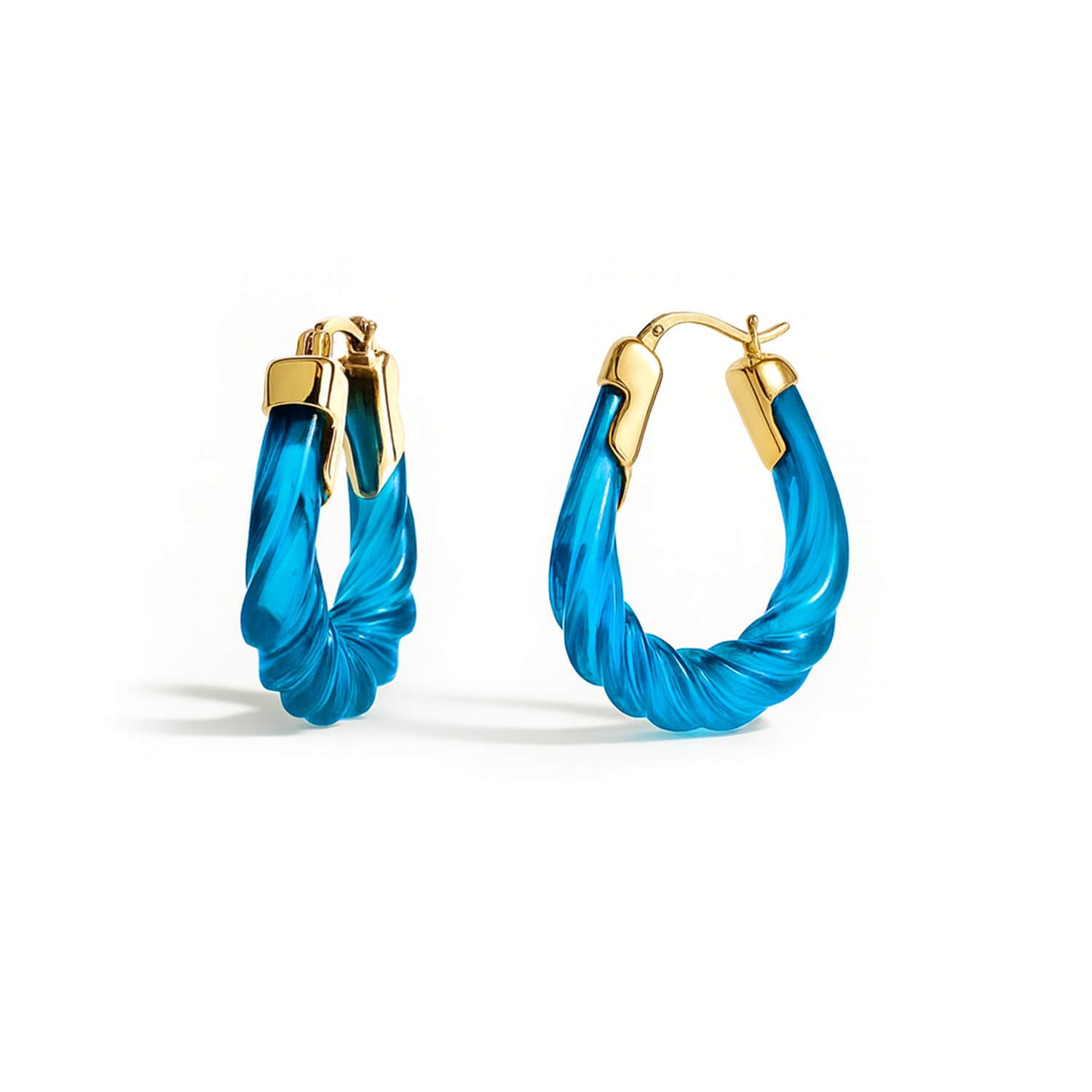 Blue hoop earrings with gold accents on a white background