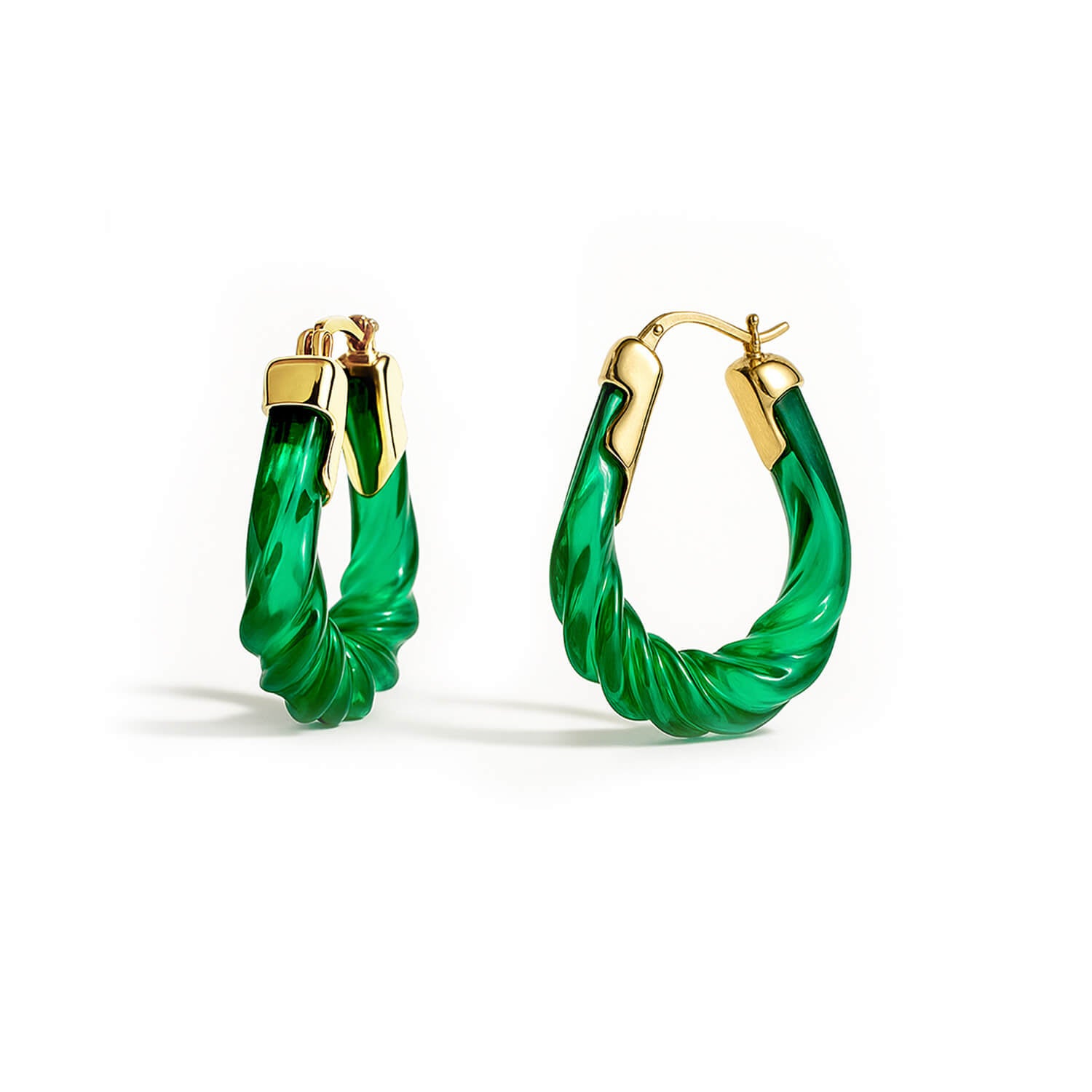 Green hoop earrings with gold accents on a white background