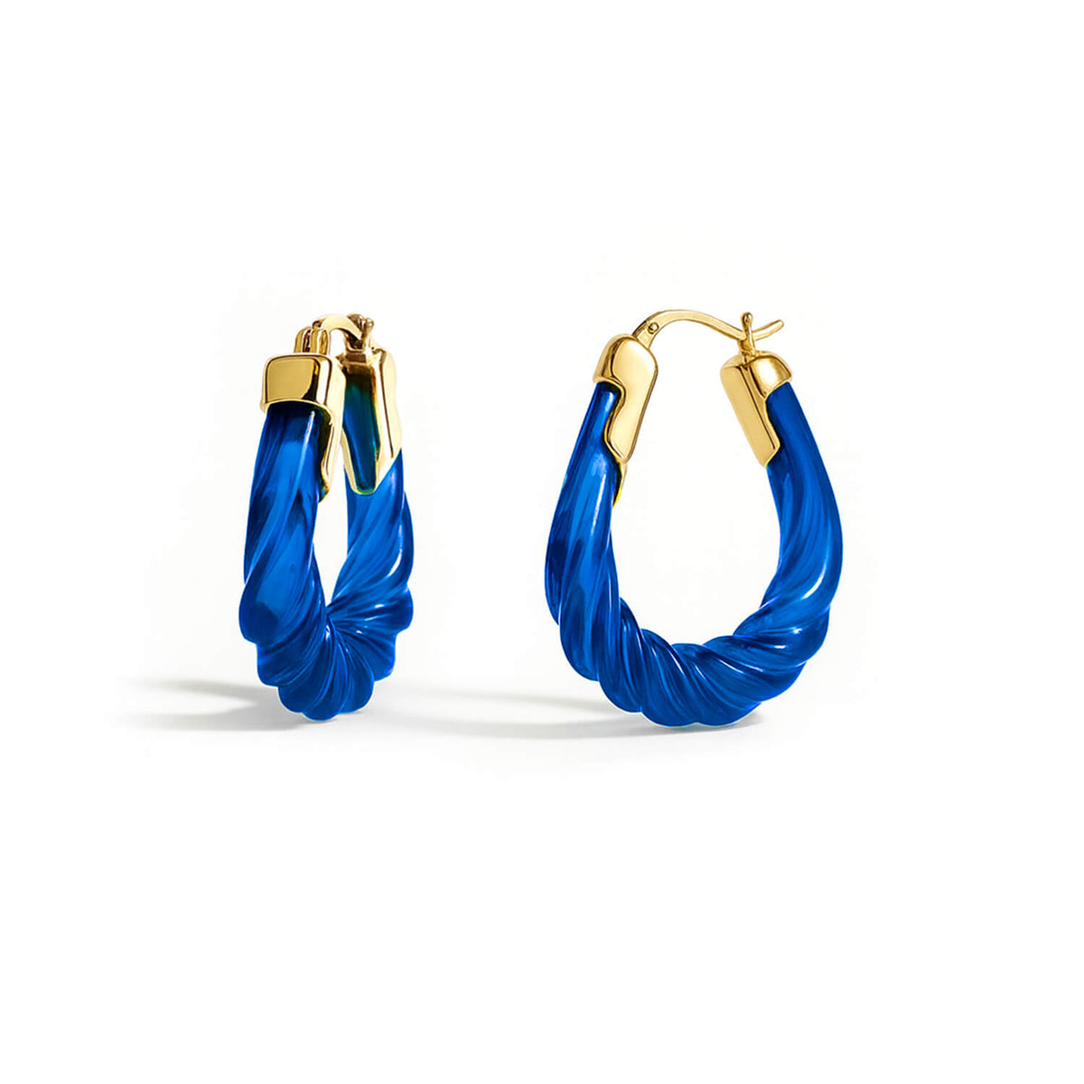 Blue hoop earrings with gold accents on a white background
