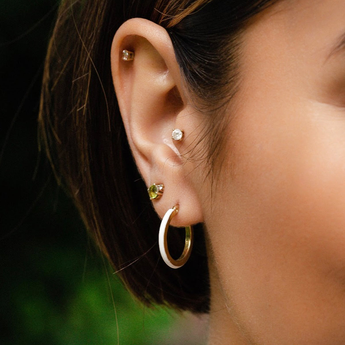 Model wearing Petite Enamel Huggie Hoop Earrings