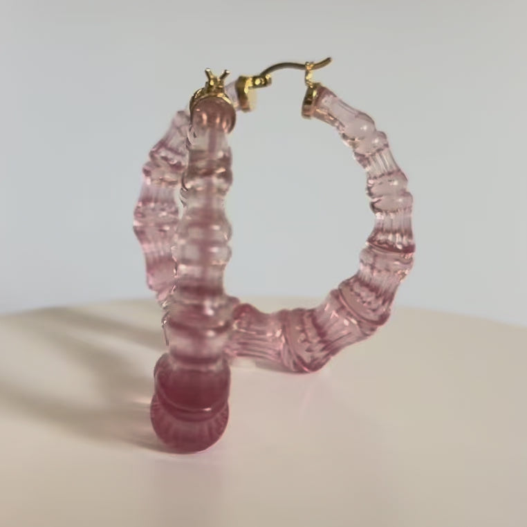 winter rose color bamboo hoop earrings on a white background - VIDEO