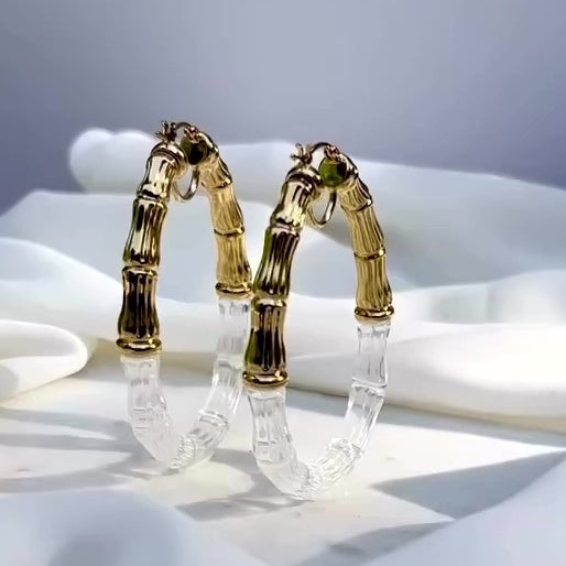 DCUHESS BAMBOO CLEAR AND GOLD HOOP EARRINGS SPINNING TO SHOW DETAILS