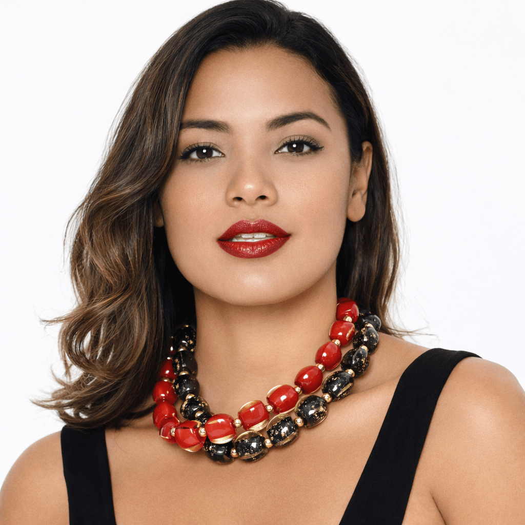 Necklace with black and gold beads on a white background