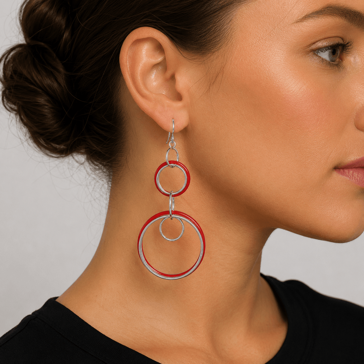 red circle geometric earrings on a model