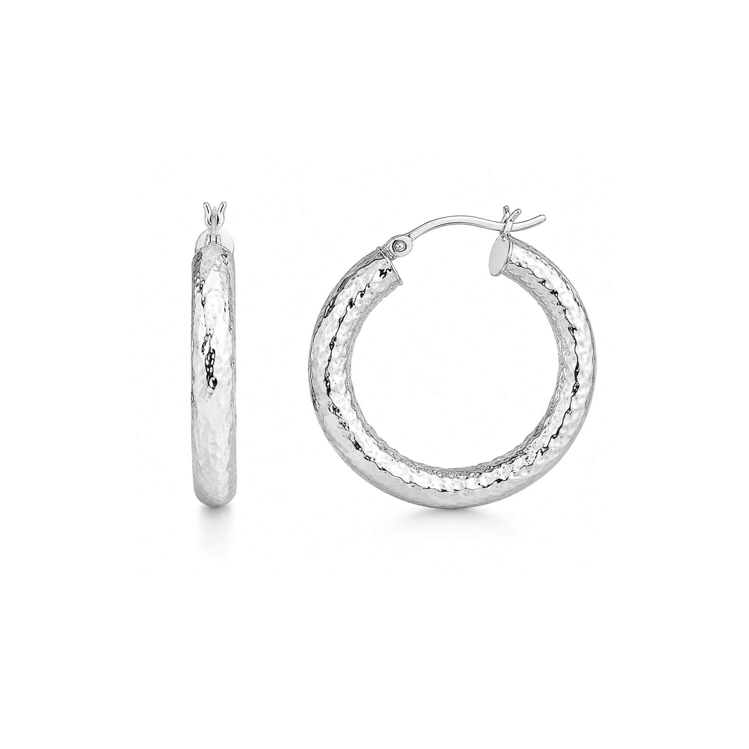 A pair of silver hoop earrings with a textured, hammered finish, shown from both a side profile and a front-facing view on a clean white background.