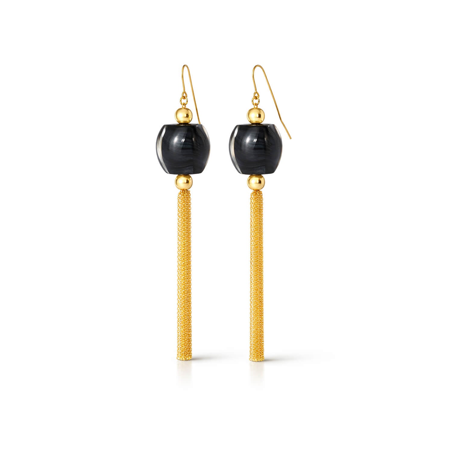 Pair of earrings with black beads and gold tassels on a white background