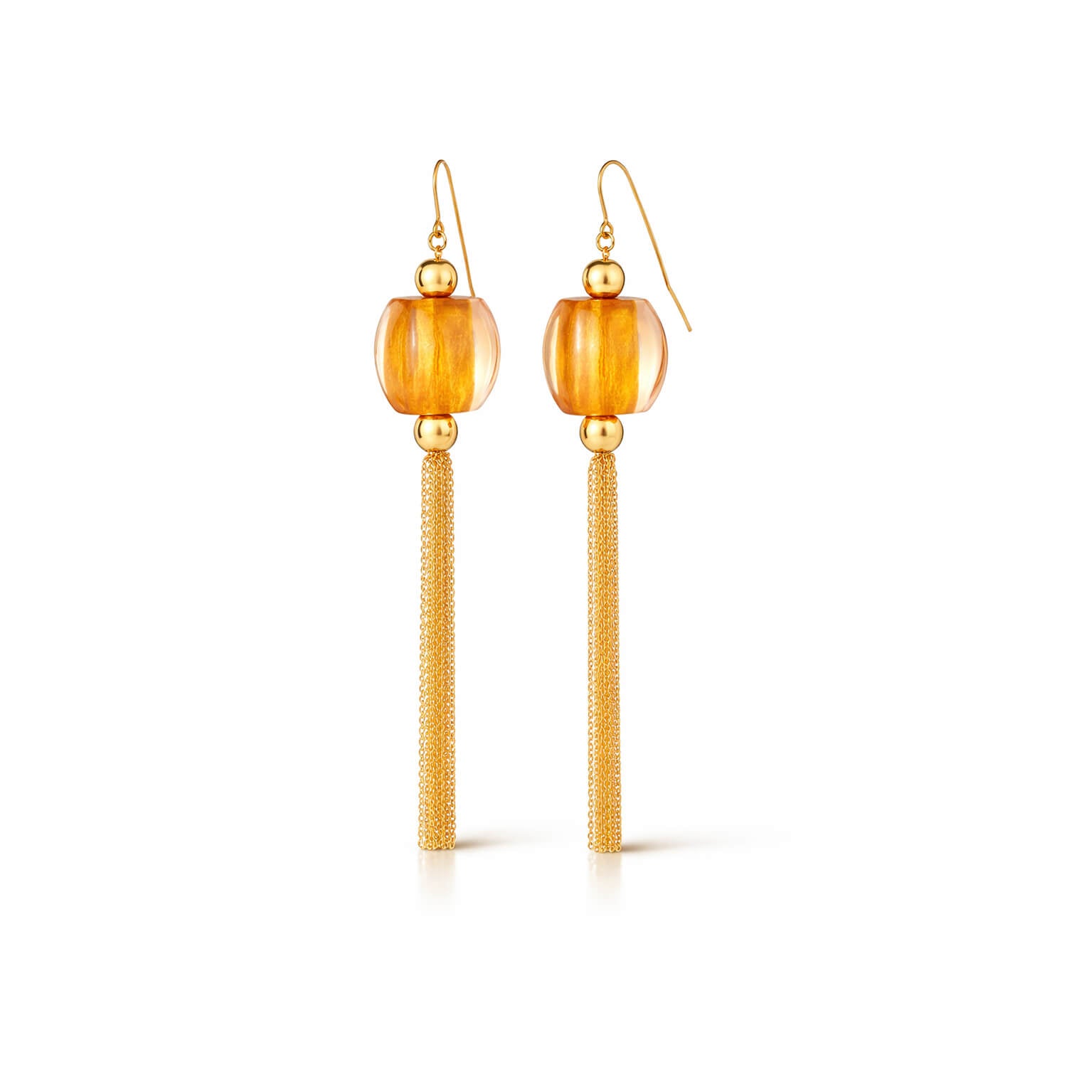 Gold earrings with orange beads on a white background