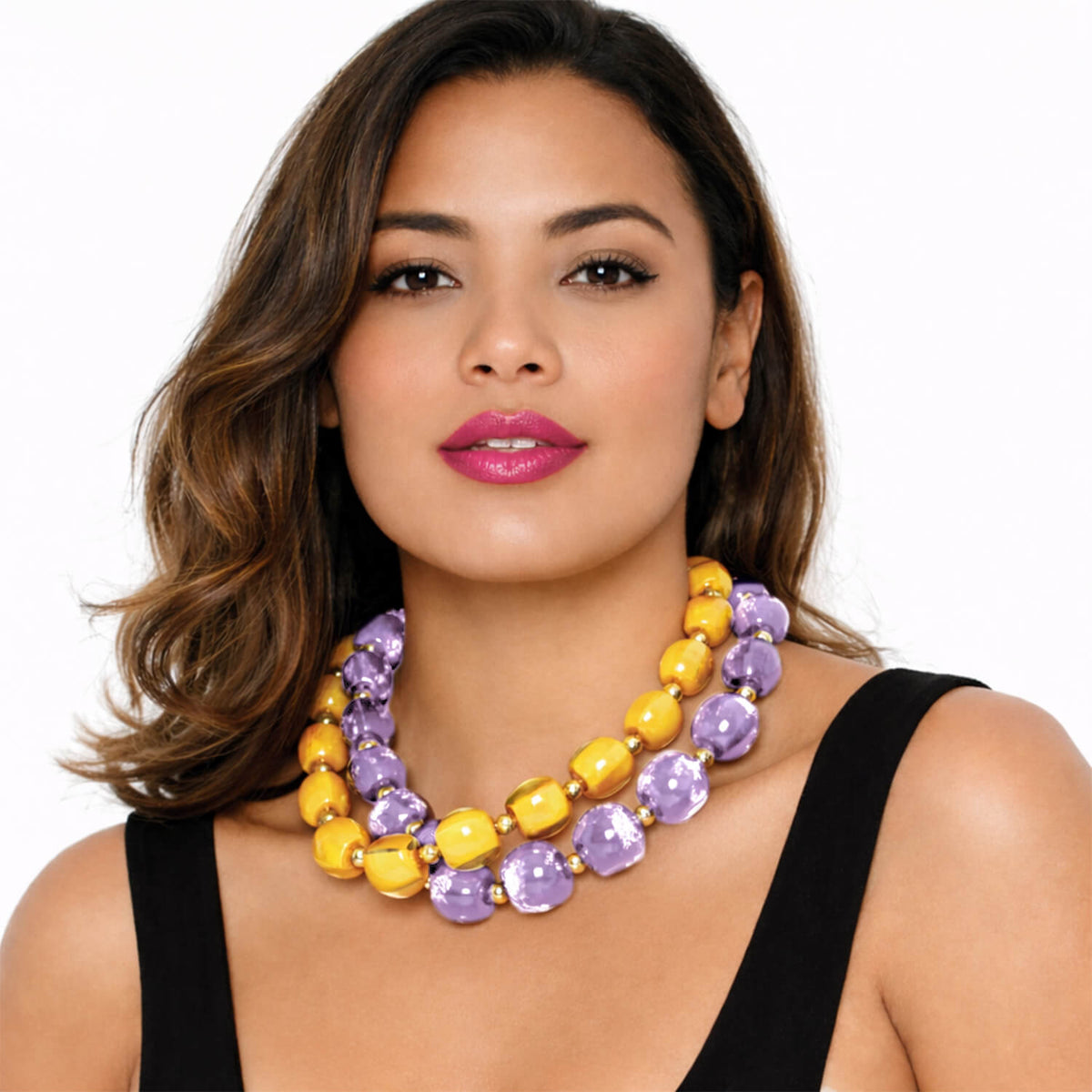 yellow and purple bead necklaces layered
