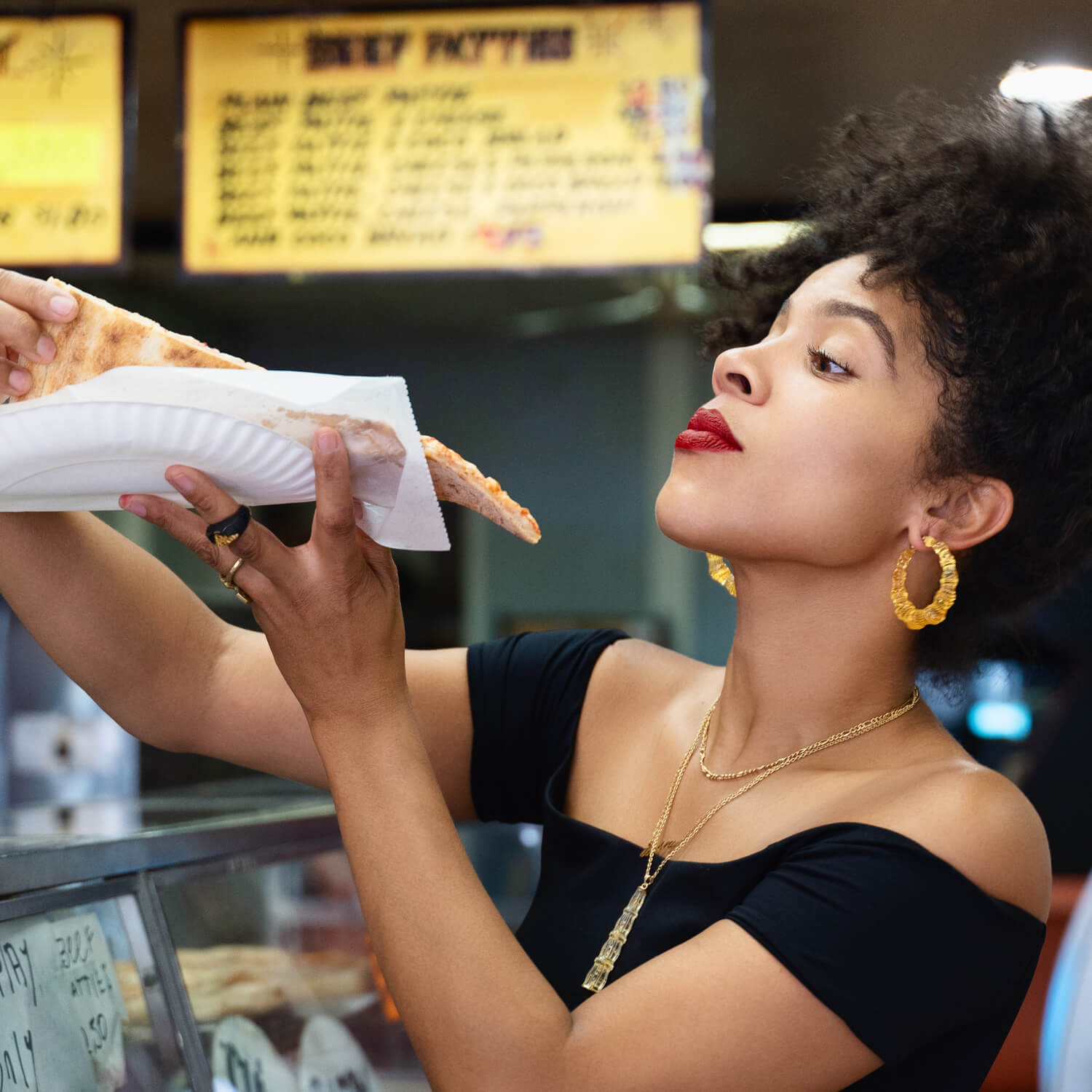 Pair of yellow honey gold bamboo hoop earrings on a white background