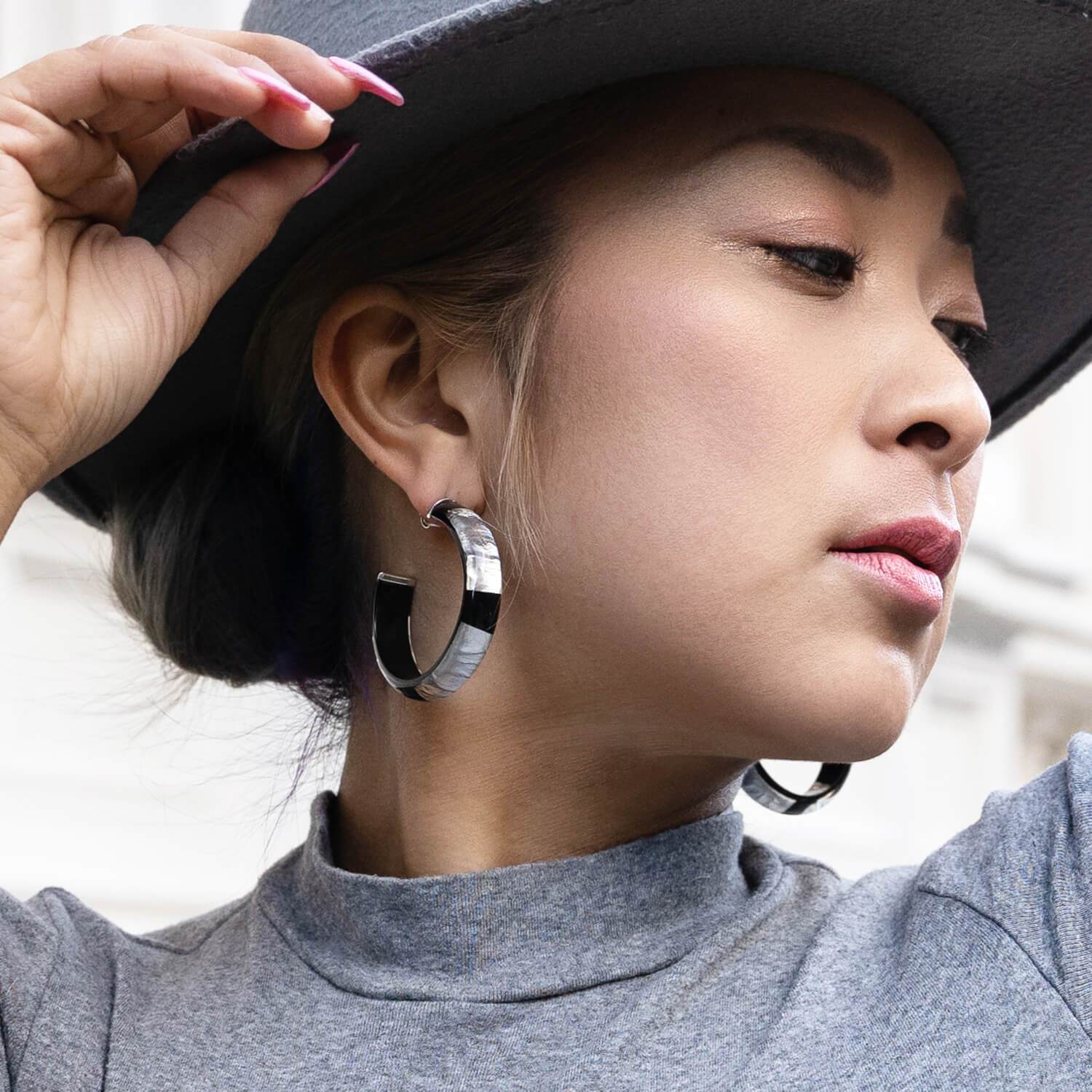 black hoop earrings with silver leaf